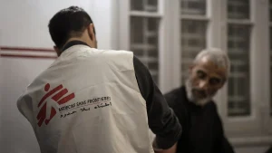 Dr Khaled Al-Shawwa is performing a minor surgery at the MSF clinic in Gaza City. Palestine, December 2024.