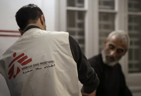 Dr Khaled Al-Shawwa is performing a minor surgery at the MSF clinic in Gaza City. Palestine, December 2024.