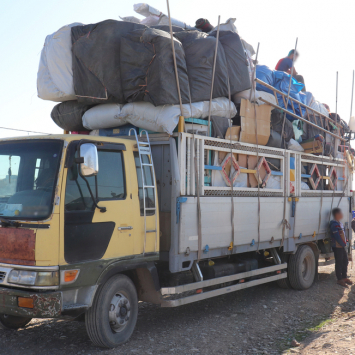 Laylan camp: trucks for belongings