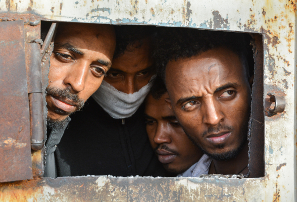 Migrants and refugees in Zintan and Gharyan detention centres in Libya